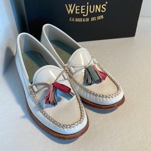 White patent upper with iconic tassels in hues of gray, green, red and pink.